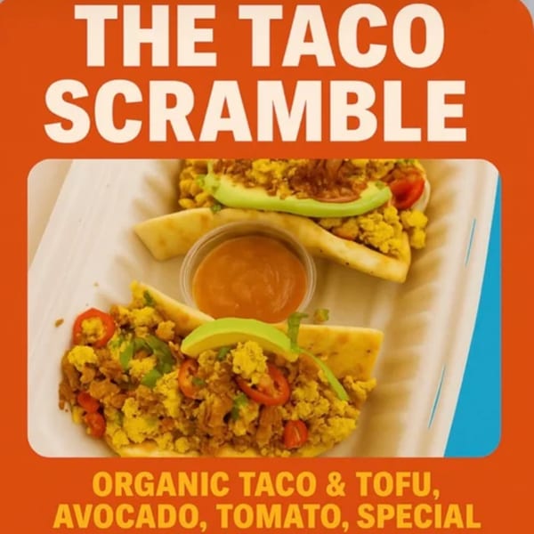 Two healthy taco scrambles with organic taco and tofu, avocado, and tomato, served with sauce.